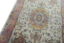 Backside of handmade 2000s Tabriz 50/60/70 Raj rug showing knot structure and weave density