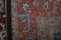Backside of handmade 2000s Tabriz 50/60/70 Raj rug showing knot structure and weave density
