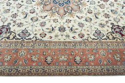 Corner detail of 2000s Tabriz 50/60/70 Raj rug showing border pattern and Cork pile