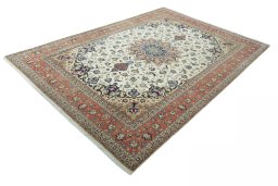 Corner detail of 2000s Tabriz 50/60/70 Raj rug showing border pattern and Cork pile