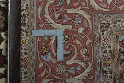 Backside of handmade 2000s Tabriz 50/60/70 Raj rug showing knot structure and weave density