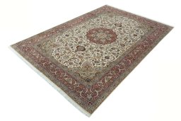 Corner detail of 2000s Tabriz 50/60/70 Raj rug showing border pattern and Cork pile