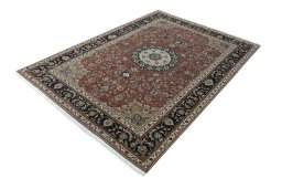 Corner detail of 2000s Tabriz 50/60/70 Raj rug showing border pattern and Cork pile