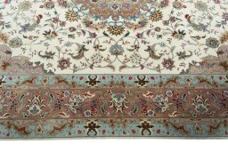 Corner detail of 2000s Tabriz 50/60/70 Raj rug showing border pattern and Cork pile