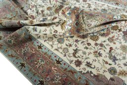 Surface texture of 2000s Tabriz 50/60/70 Raj rug with natural Cork and intricate pattern