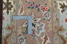 Backside of handmade 2000s Tabriz 50/60/70 Raj rug showing knot structure and weave density