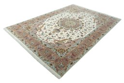 Corner detail of 2000s Tabriz 50/60/70 Raj rug showing border pattern and Cork pile