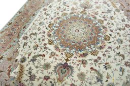 Backside of handmade 2000s Tabriz 50/60/70 Raj rug showing knot structure and weave density
