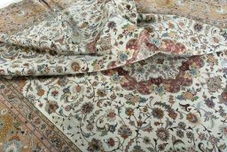 Backside of handmade 2000s Tabriz 50/60/70 Raj rug showing knot structure and weave density