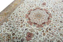 Backside of handmade 2000s Tabriz 50/60/70 Raj rug showing knot structure and weave density