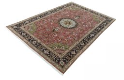 Corner detail of 2000s Tabriz 50/60/70 Raj rug showing border pattern and Cork pile