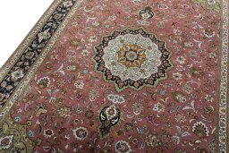 Backside of handmade 2000s Tabriz 50/60/70 Raj rug showing knot structure and weave density
