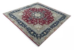 Corner detail of 2000s Tabriz 50/60/70 Raj rug showing border pattern and Cork pile