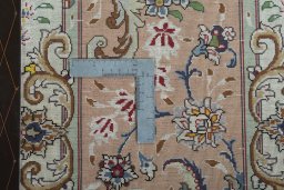 Backside of handmade 2000s Tabriz 50/60/70 Raj rug showing knot structure and weave density