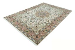 Corner detail of 2000s Tabriz 50/60/70 Raj rug showing border pattern and Cork pile