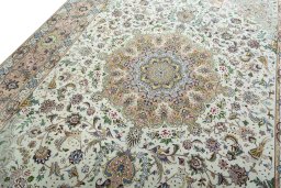 Backside of handmade 2000s Tabriz 50/60/70 Raj rug showing knot structure and weave density