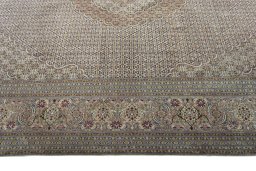 Corner detail of 2000s Tabriz 50/60/70 Raj rug showing border pattern and Cork pile