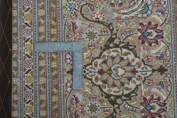 Backside of handmade 2000s Tabriz 50/60/70 Raj rug showing knot structure and weave density