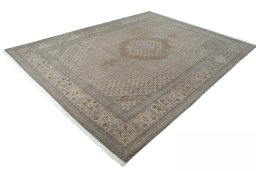 Corner detail of 2000s Tabriz 50/60/70 Raj rug showing border pattern and Cork pile
