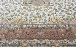 Corner detail of 2000s Tabriz 50/60/70 Raj rug showing border pattern and Cork pile