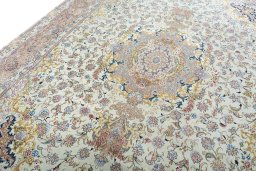 Backside of handmade 2000s Tabriz 50/60/70 Raj rug showing knot structure and weave density