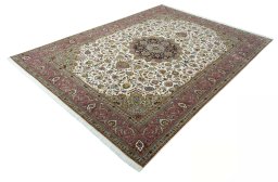 Corner detail of 2000s Tabriz 50/60/70 Raj rug showing border pattern and Cork pile
