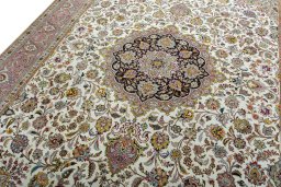Backside of handmade 2000s Tabriz 50/60/70 Raj rug showing knot structure and weave density