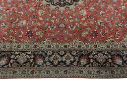 Corner detail of 2000s Tabriz 50/60/70 Raj rug showing border pattern and Cork pile