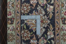 Backside of handmade 2000s Tabriz 50/60/70 Raj rug showing knot structure and weave density