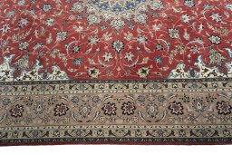 Corner detail of 2000s Tabriz 50/60/70 Raj rug showing border pattern and Cork pile