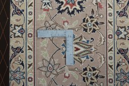 Backside of handmade 2000s Tabriz 50/60/70 Raj rug showing knot structure and weave density