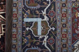 Backside of handmade 2000s Tabriz 50/60/70 Raj rug showing knot structure and weave density