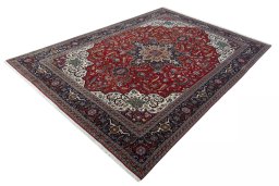 Corner detail of 2000s Tabriz 50/60/70 Raj rug showing border pattern and Cork pile