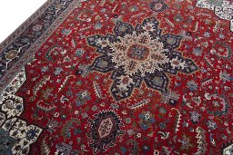 Backside of handmade 2000s Tabriz 50/60/70 Raj rug showing knot structure and weave density