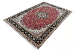 Corner detail of 2000s Tabriz 50/60/70 Raj rug showing border pattern and Cork pile