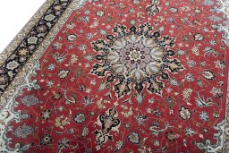Backside of handmade 2000s Tabriz 50/60/70 Raj rug showing knot structure and weave density