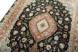 Backside of handmade 2000s Tabriz 50/60/70 Raj rug showing knot structure and weave density