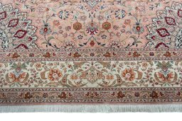 Corner detail of 2000s Tabriz 50/60/70 Raj rug showing border pattern and Cork pile
