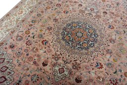 Backside of handmade 2000s Tabriz 50/60/70 Raj rug showing knot structure and weave density