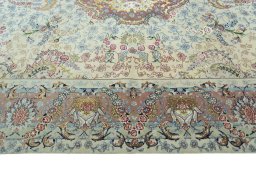 Corner detail of 2000s Tabriz 50/60/70 Raj rug showing border pattern and Cork pile