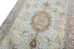 Backside of handmade 2000s Tabriz 50/60/70 Raj rug showing knot structure and weave density