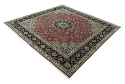 Corner detail of 2000s Tabriz 50/60/70 Raj rug showing border pattern and Cork pile