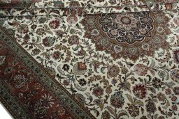 Surface texture of 2000s Tabriz 50/60/70 Raj rug with natural Cork and intricate pattern