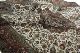 Backside of handmade 2000s Tabriz 50/60/70 Raj rug showing knot structure and weave density