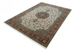 Corner detail of 2000s Tabriz 50/60/70 Raj rug showing border pattern and Cork pile