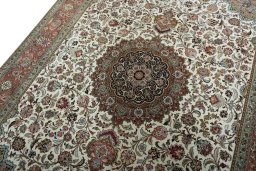 Backside of handmade 2000s Tabriz 50/60/70 Raj rug showing knot structure and weave density