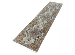 Corner detail of 2000s Tabriz 50/60/70 Raj rug showing border pattern and Cork pile