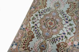 Backside of handmade 2000s Tabriz 50/60/70 Raj rug showing knot structure and weave density