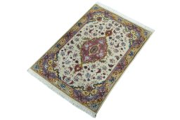 Corner detail of 2000s Tabriz 50/60/70 Raj rug showing border pattern and Cork pile