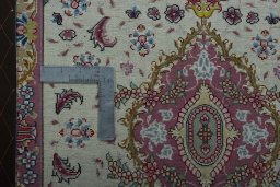 Corner detail of 2000s Tabriz 50/60/70 Raj rug showing border pattern and Cork pile
